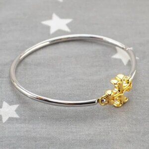 Tory Burch Eleanor Hinged Cuff Bracelet in Gold / Silver.